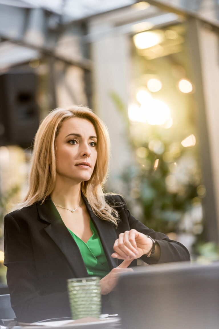portrait of beautiful woman waiting for someone in cafe