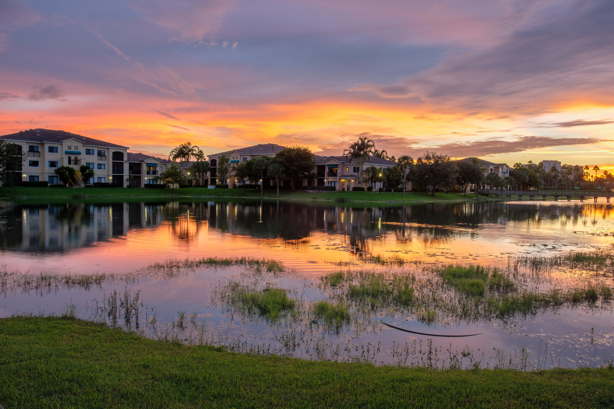 a row of big houses near a body of water